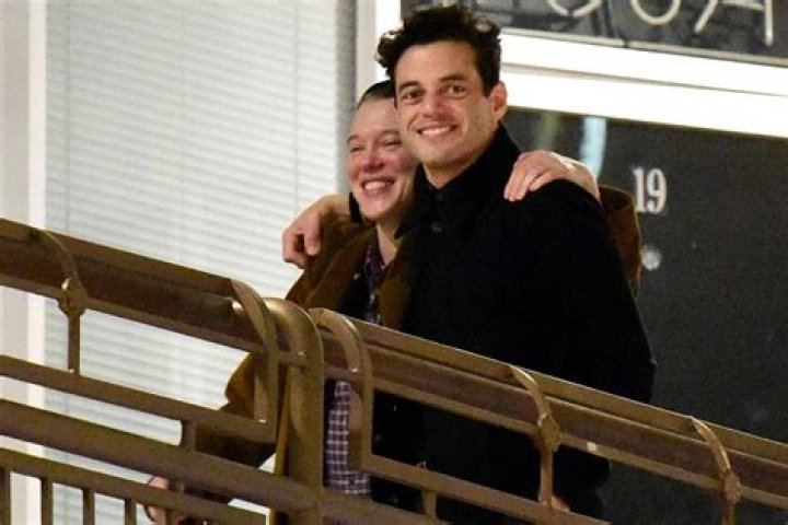 Rami Malek and Léa Seydoux Smile as They Walk with Their Arms Around Each Other
